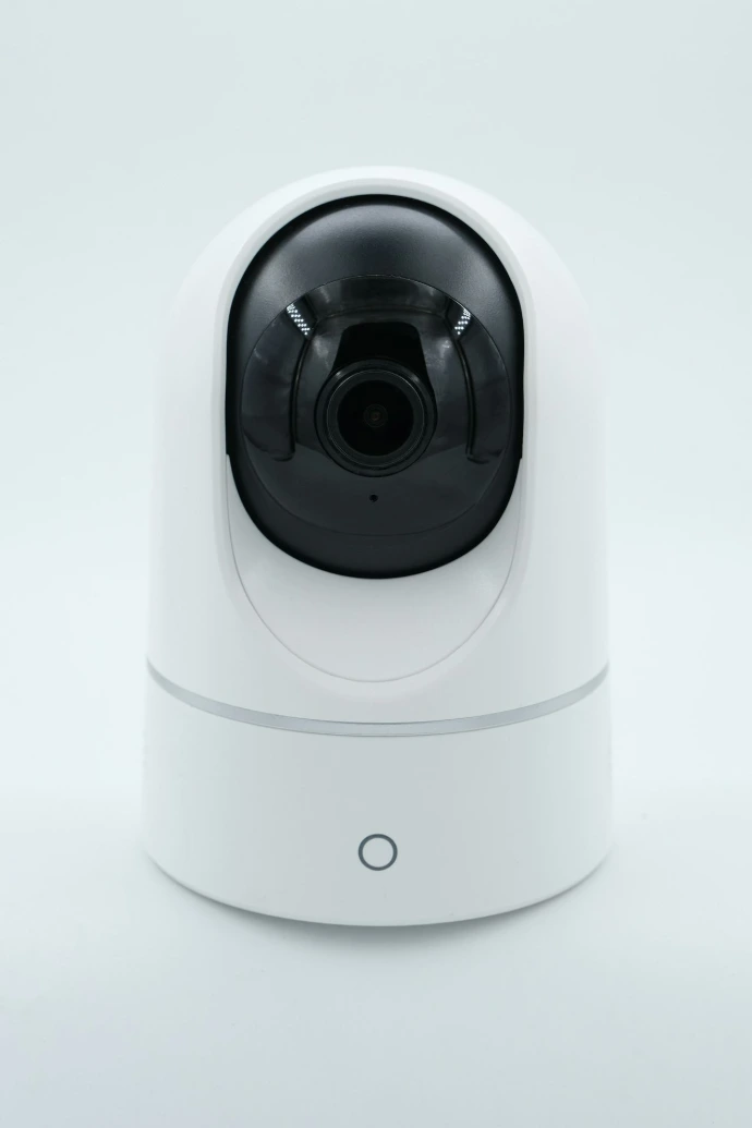 a white camera on a white surface